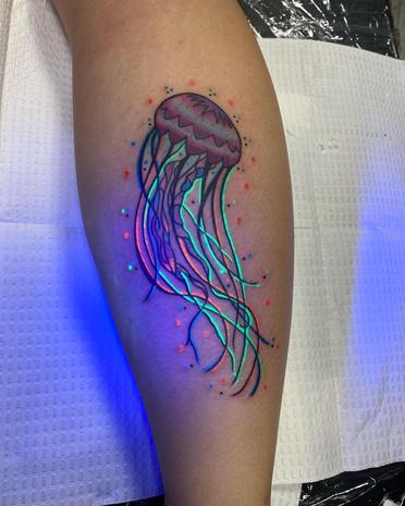 watercolor jellyfish tattoo arm
