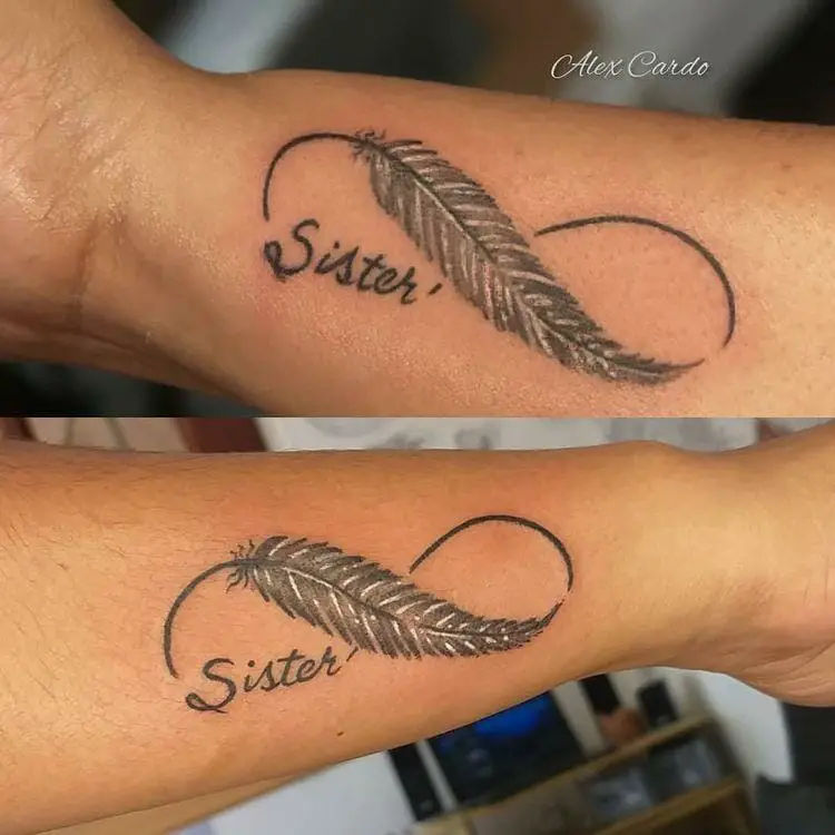 Sioux Falls Tattoo Feather And Bird Tattoo In The Shape Of The Infinity  Symbol With A Commemorative Initial And Red Heart On The Forearm  Starry  Eyed Tattoos and Body Art Studio