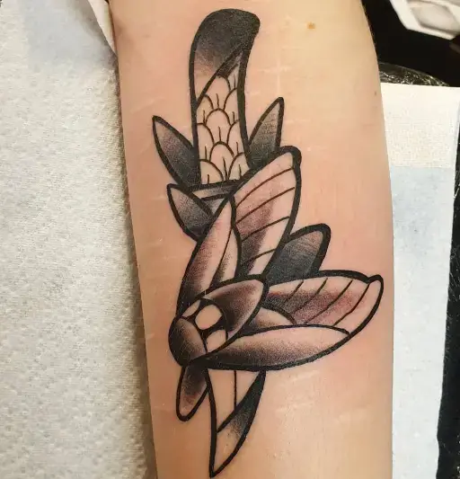 Combination of Dagger and Moth Tattoos