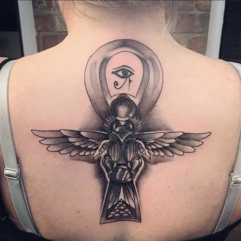 African Bird And Eye Tattoo on back