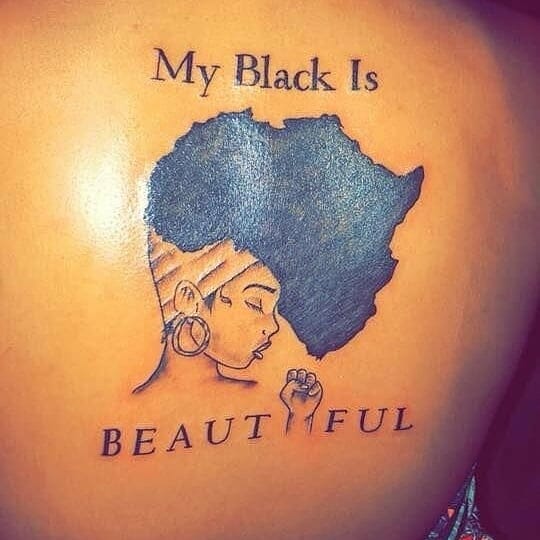 African GIrl Face Tattoo On Back