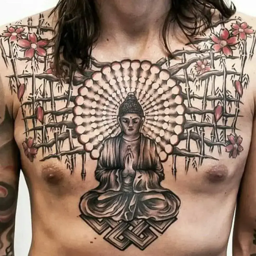 Amazing Buddha and flowers chest tattoo