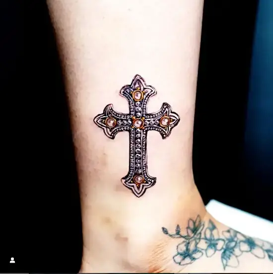 Funky cross tattoo