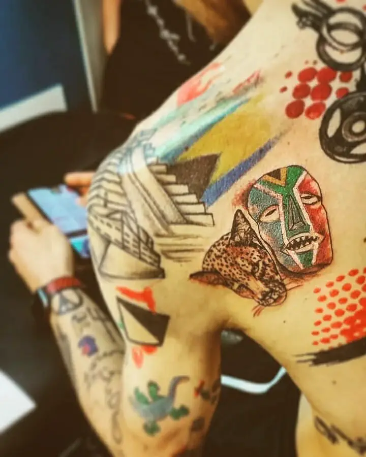 Colorful African Mask Tattoo On Back