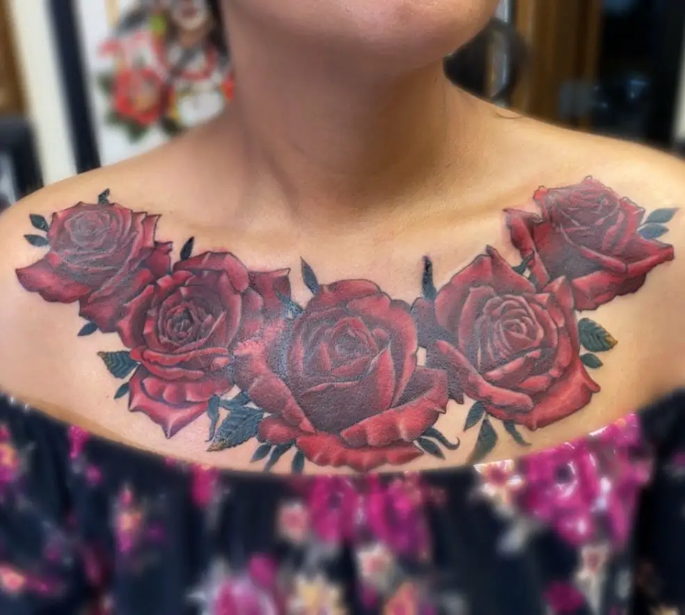 Couple of red rose tattoos on chest
