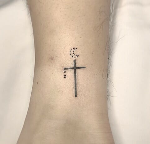Moon design cross tattoo