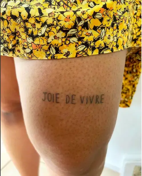 French Wording tattoo for thigh