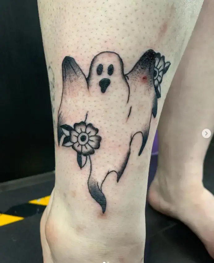 Ghost Holding Flowers Tattoo