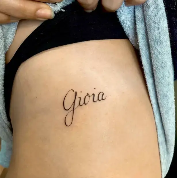 Gioia Simple Script Wording tattoo for thigh