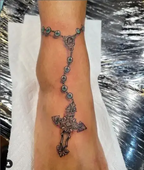 Beautiful art on cross tattoo