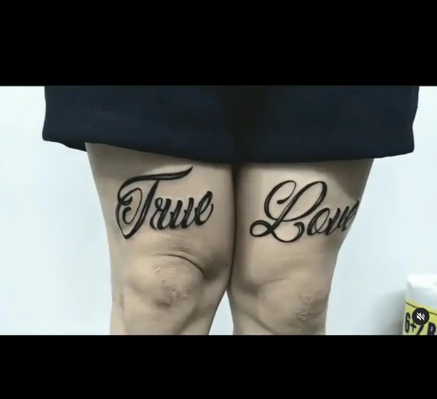 Love Wording Tattoo On Thigh