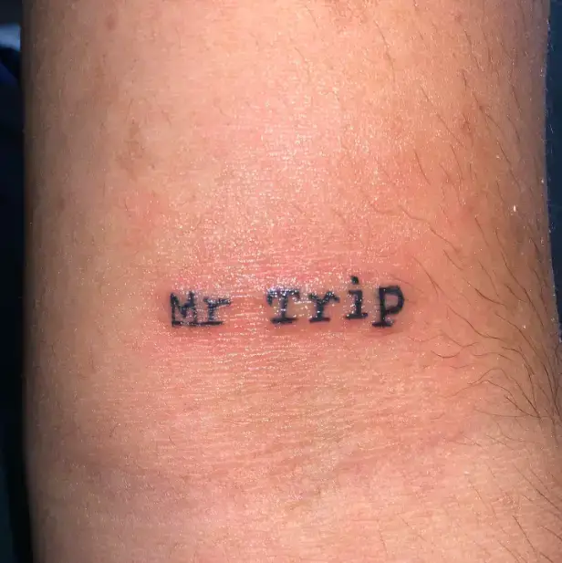 Mr Trip One Wording tattoo for thigh
