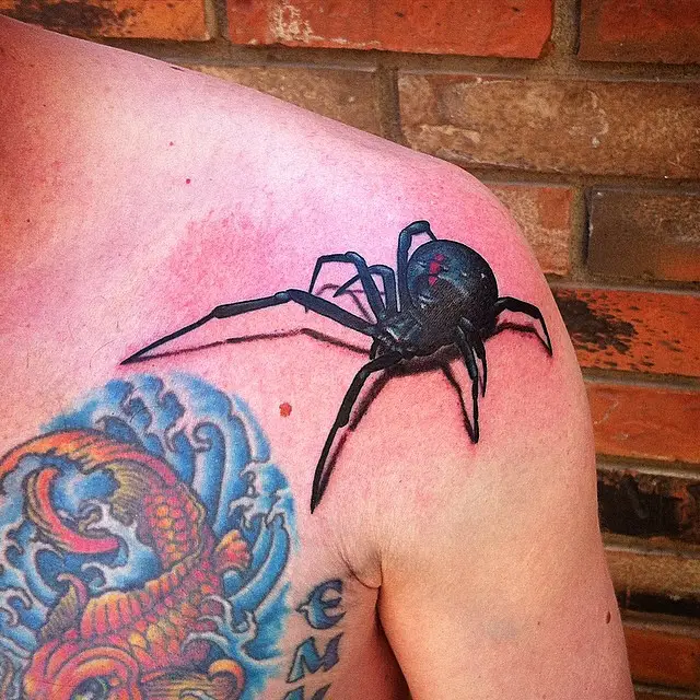 Spider tattoo on shoulder