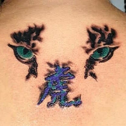 Tiger Eyes Tattoo On Back