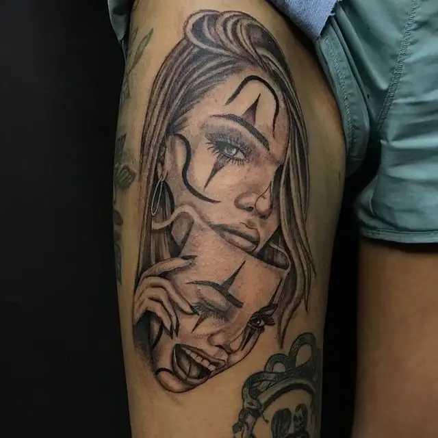 Weeping face behind smiling face tattoo design