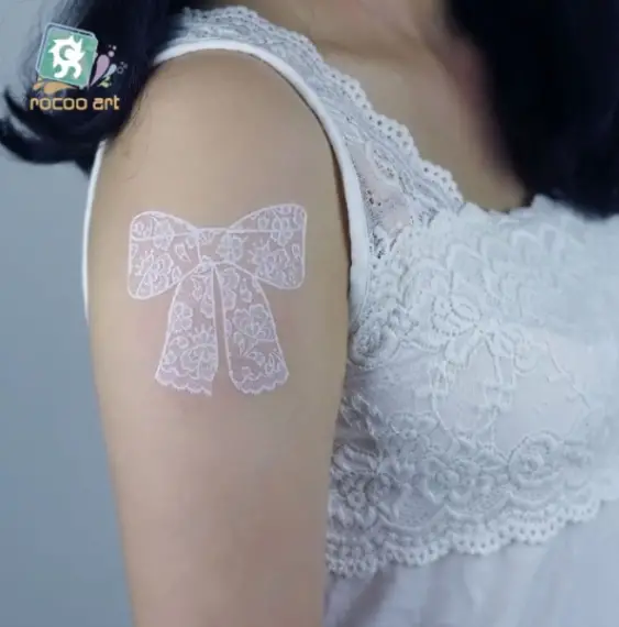 White Ink Lace Shoulder Tattoo