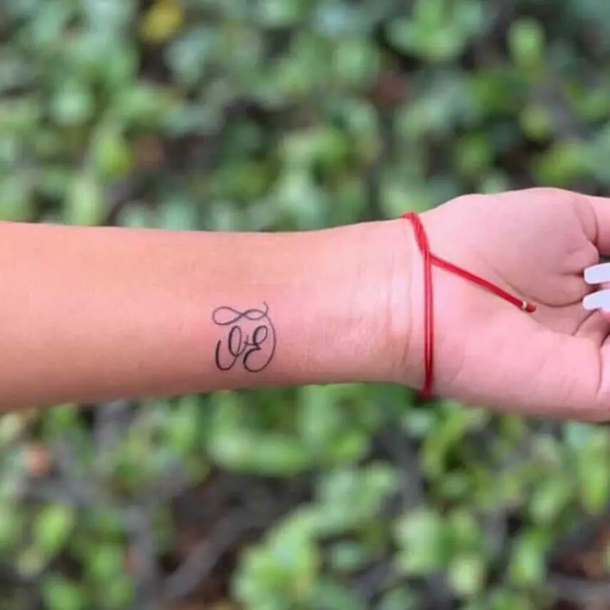Wonderful Initials Tattoo On Wrist