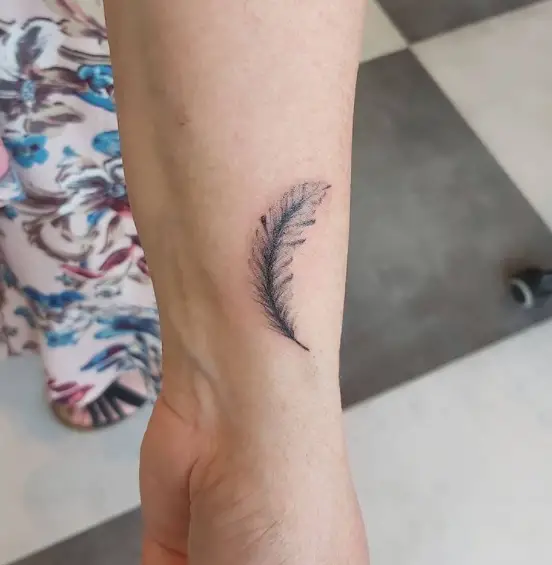tiny feather tattoo