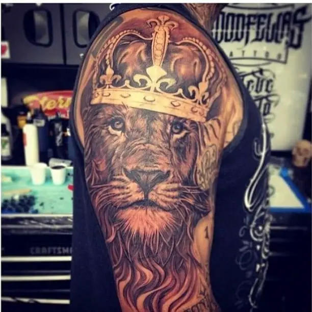 Black And Gray Lion Shoulder Tattoo